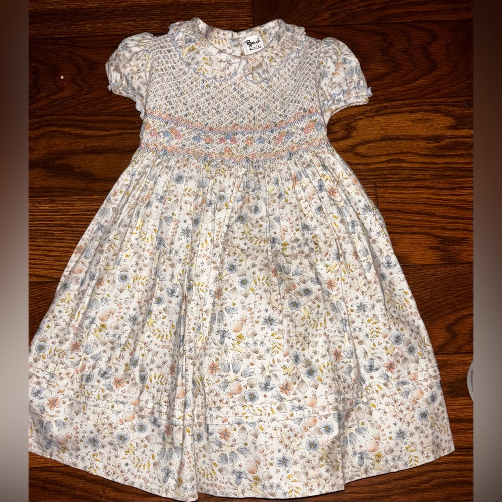 Sarah Louise Girls Floral Smocked Dress with a hand-smocked size age 2